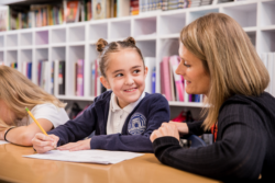 Teacher helping a student