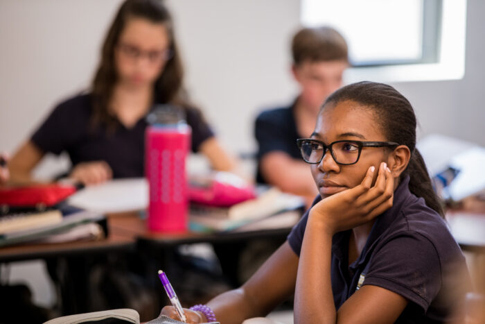 Student at desk looking forward