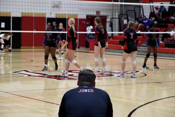 Athletic Director Anthony Jones watching volleyball players