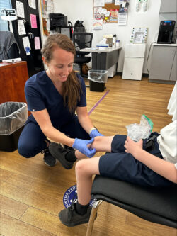 School nurse helping student