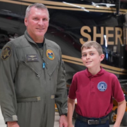 Jacob T. with one of his rescuers