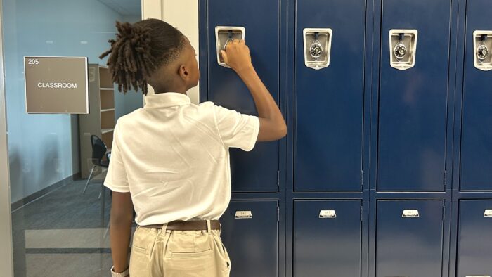 Harveston student at a locker
