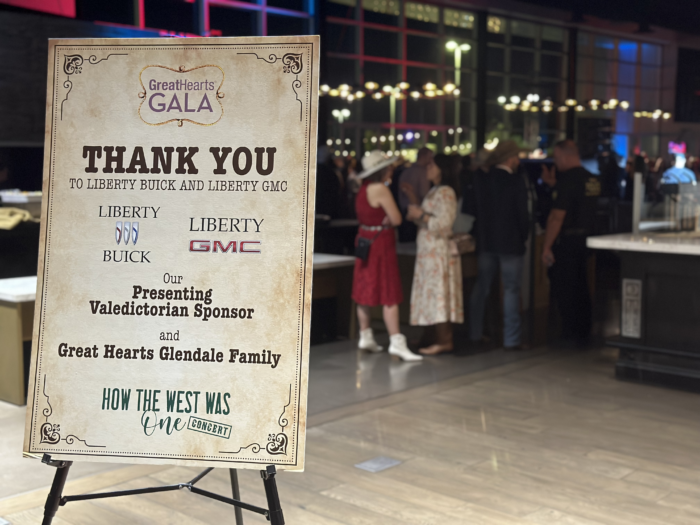 Gala Thank You Sign with guests in the background