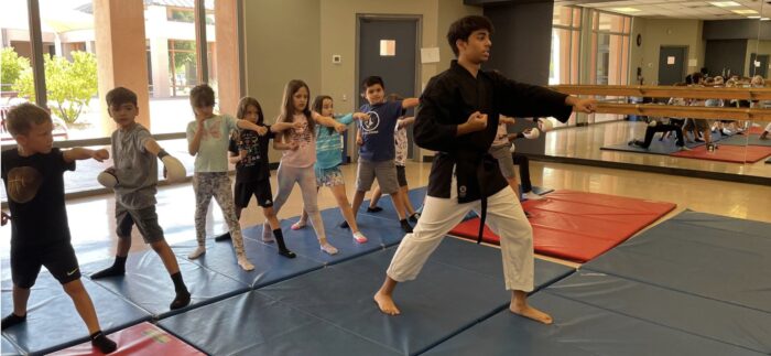 Scottsdale senior teaching a karate class for younger students
