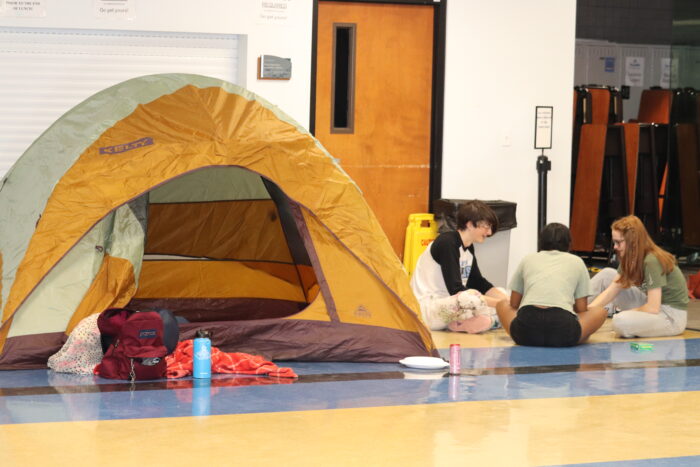 A tent and students at the Iliadathon