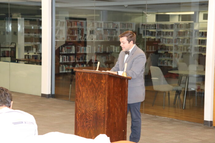 A faculty member reciting from The Iliad at the Iliadathon.