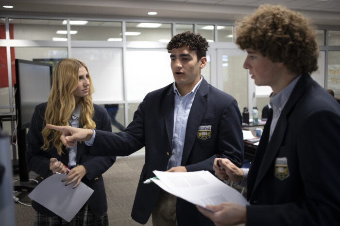 Upper school students working together in class