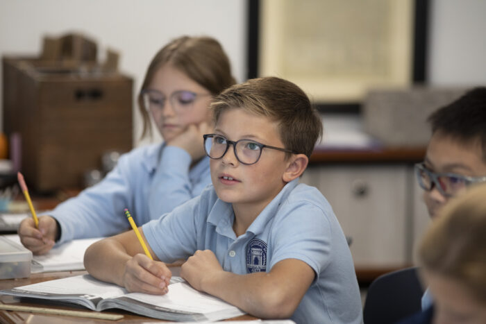 lower school students working at desk