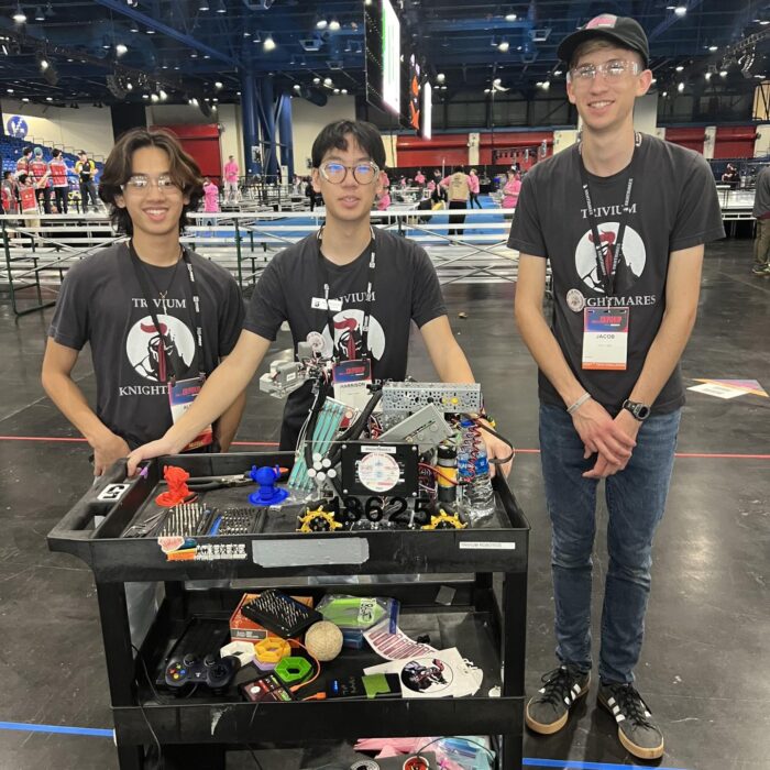 Trivium FTC members with their robot