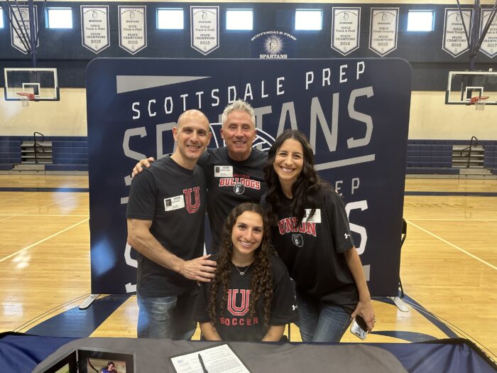 Scottsdale senior with her family after signing her Letter of Intent to play college soccer at Union University.