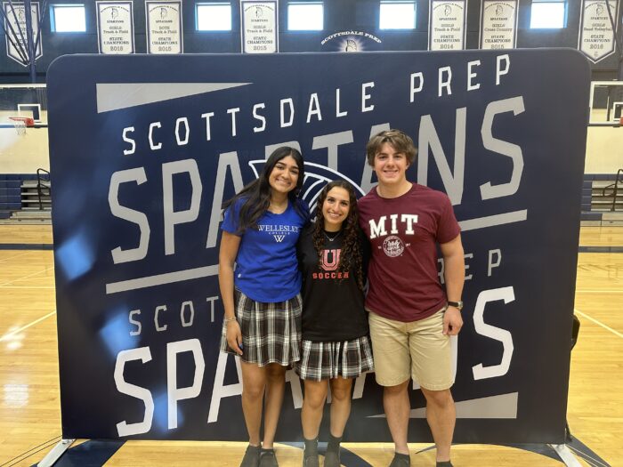 Three Scottsdale seniors celebrating signing their Letter of Intent to play college sports at their respective schools.