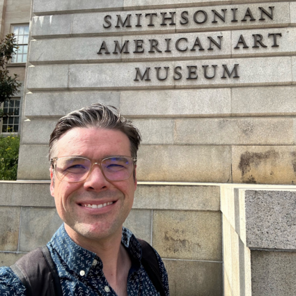 Mr. Demerest-Smith in front of the Smithsonian American Art Museum