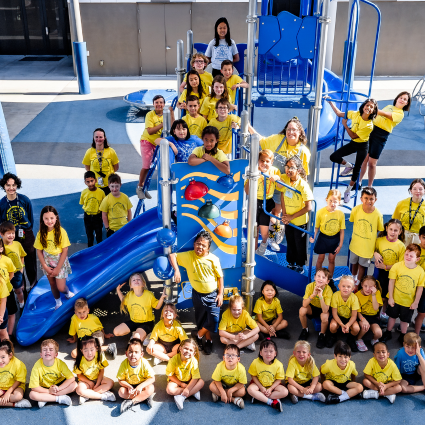 Large group of summer camp scholars in the playground