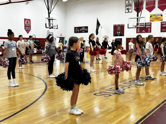 Group of girls with pom poms at Cheer Clinic