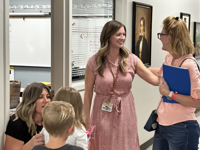 Teacher greeting a parent