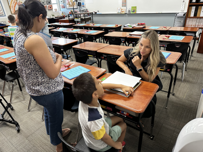 teacher meeting a student with their parent