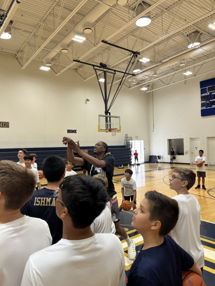 Jalen Williams shooting around with Lincoln Prep athletes at Summer Basketball Camp