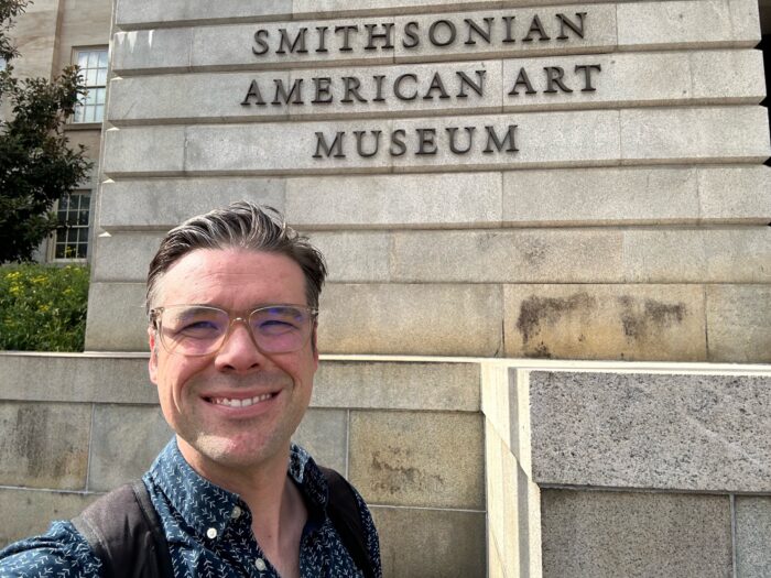 Mr. Demerest-Smith in front of the Smithsonian American Art Museum