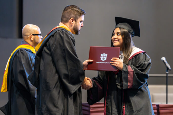 Graduate receiving diploma