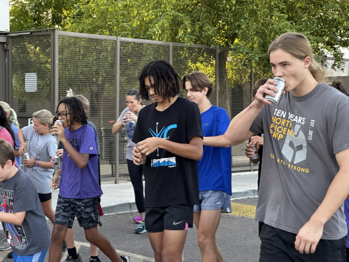 North Phoenix Prep runners guzzling down root beer at the annual Root Beer Mile