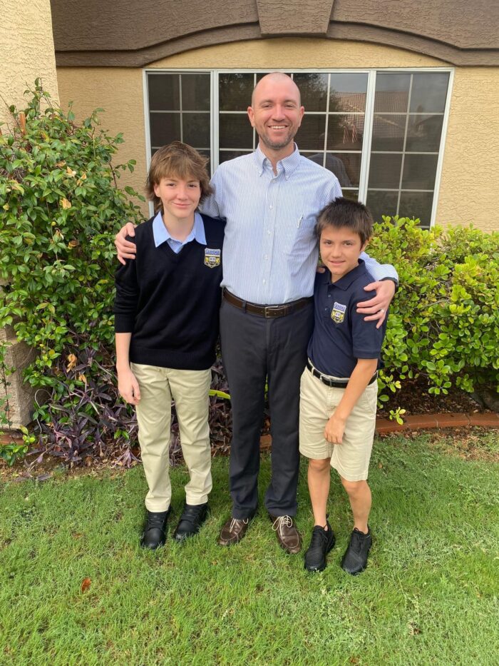 Brandon Crow with his sons on first day of school