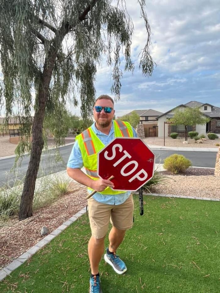 A crossing guard with a stop sign