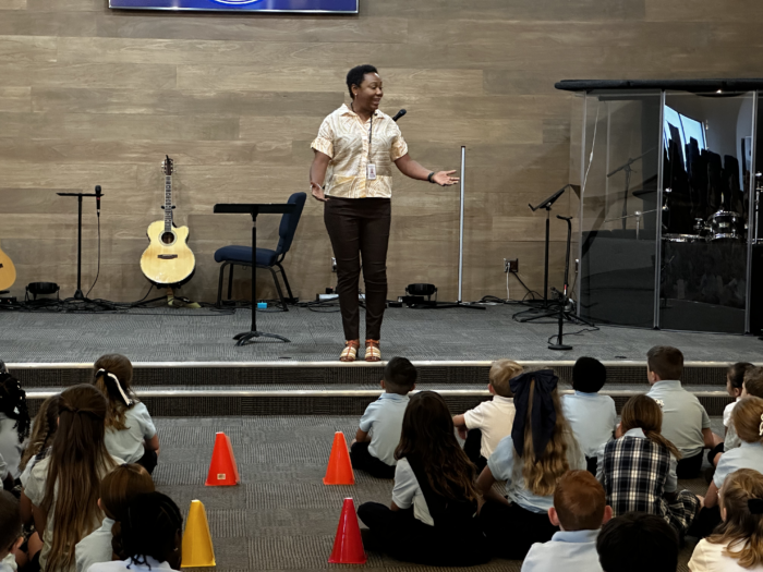 Toyin Atolgbe addressing students during chapel at Great Hearts Christos in Gilbert