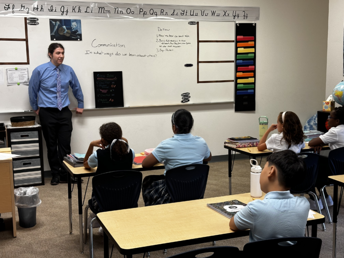 Teacher in front of classroom of students