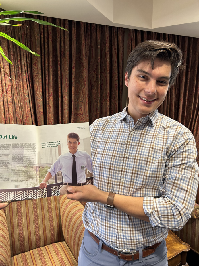 Michael Pati with 10 year-old magazine article featuring him as a senior