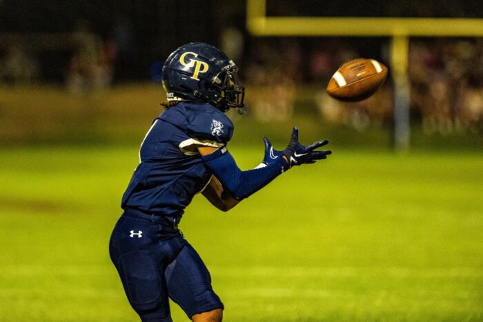 Glendale Prep Griffin football player catching the ball