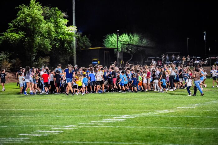 Crowd of kids on Glendale Prep Griffin football field