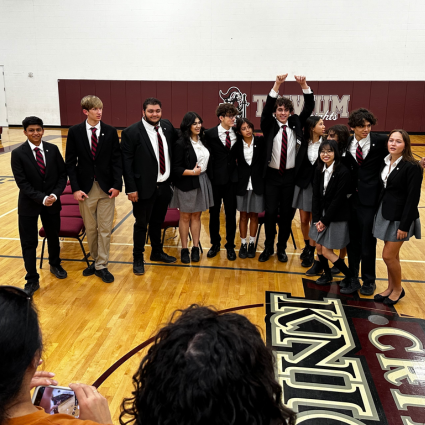 Group of students in uniforms getting their picture taken