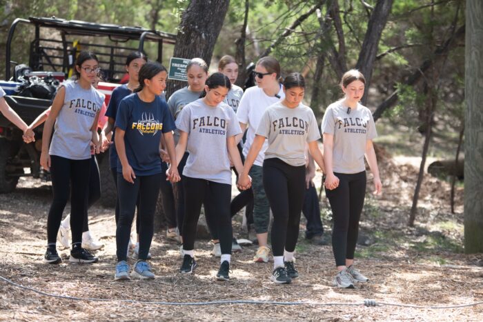 Group of students walking in the woods