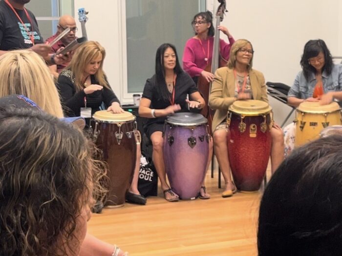 Women playing large drums