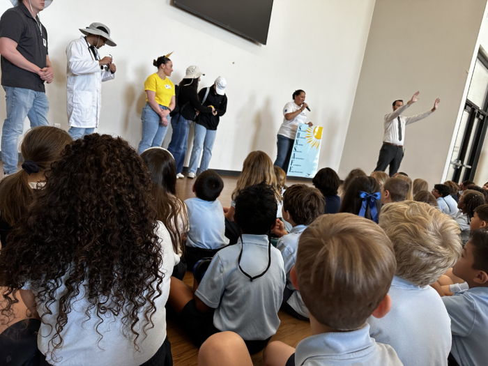 Group of adults presenting to students