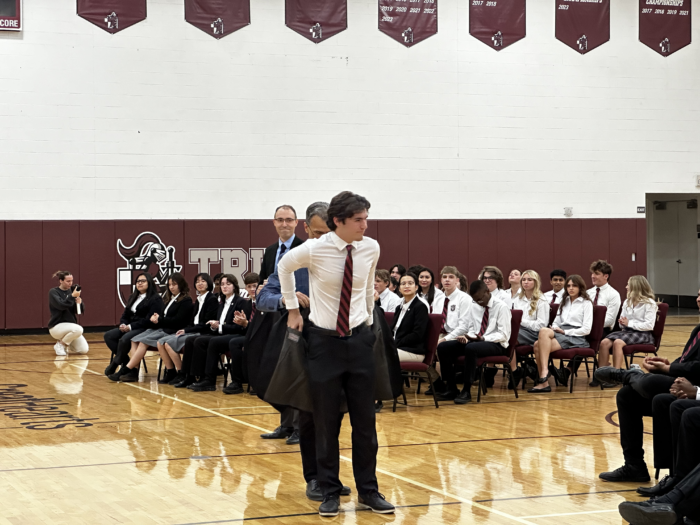 Student receiving a blazer