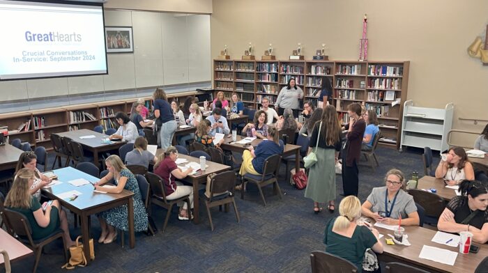 Group of teachers and faculty in a library