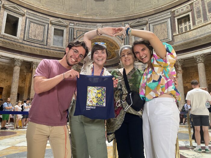 4 adults standing in a museum