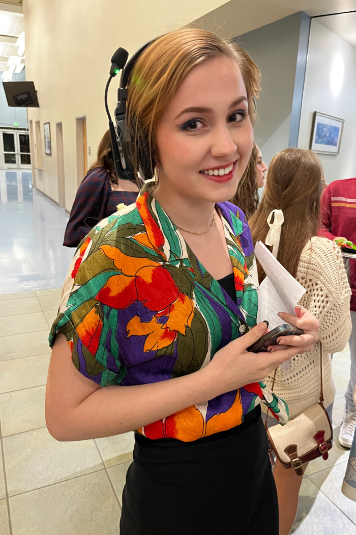 Female student wearing a headset with a mic