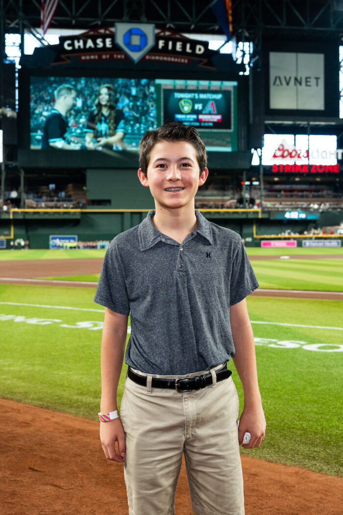 Student standing in Chase Field