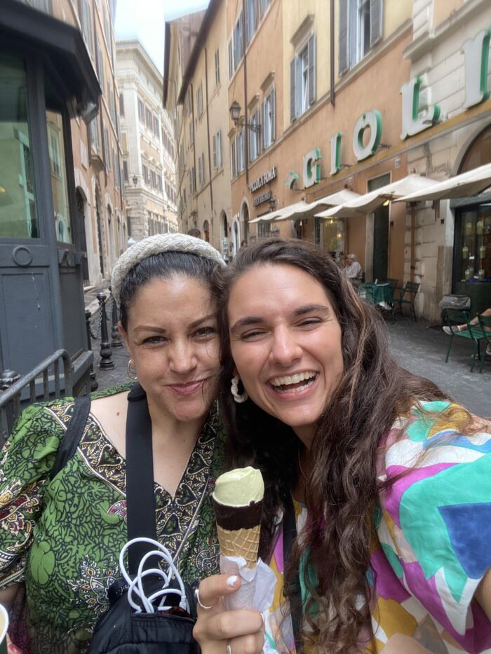 two women standing in a street