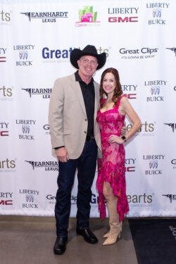 A couple dressed in country glam attire