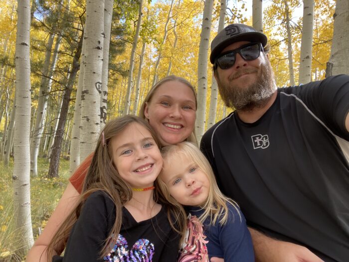 Headmaster Thomas Taylor with his family in the woods