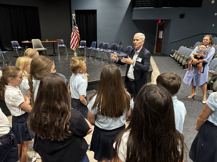 Judge speaking with a group of students