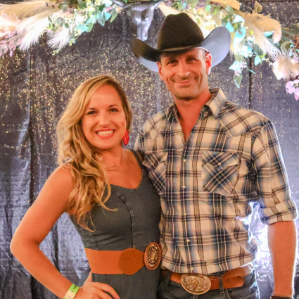 A couple in country glam posing at Great Hearts Gala