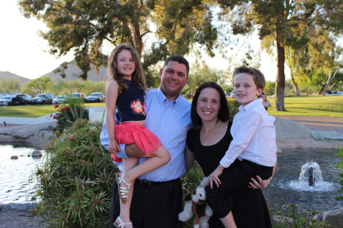 A family of four at a park