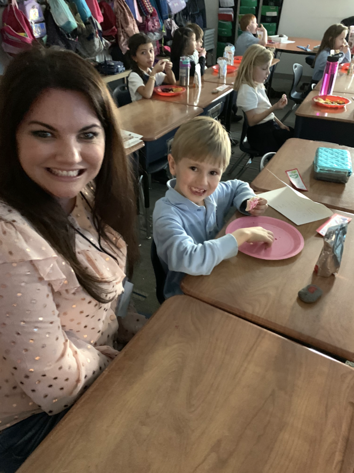 A mother with her child in a classroom