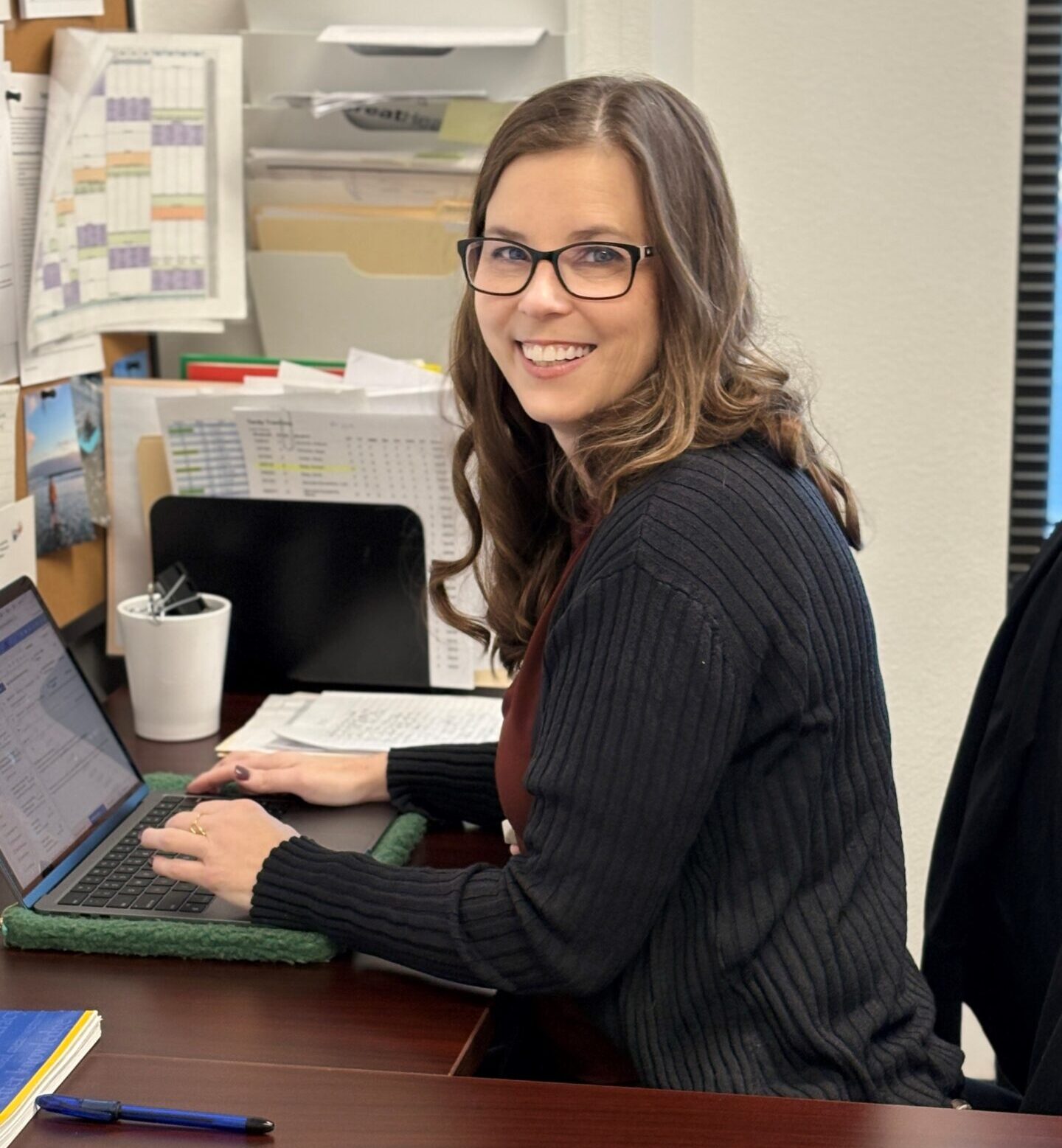 Ms. Erin Stecker at her desk