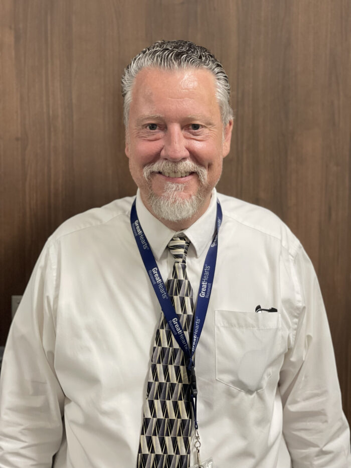 Mr. Tucker standing in front of a door