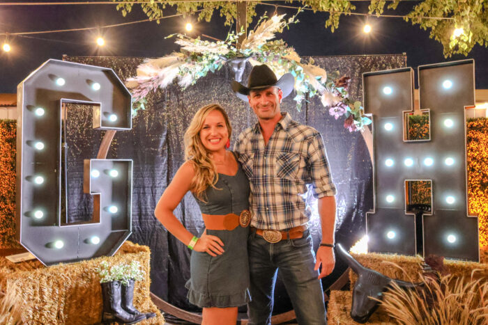 A couple in country glam posing at Great Hearts Gala